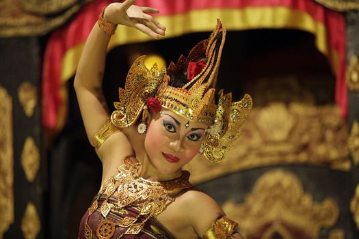 BALI, JIMBARAN, INDONESIA - 23 JULY, 2012:  Portrait of dancing girl in national clothes. Traditional daily representation in Jimbaran to Bali 23 July 2012, Indonesia