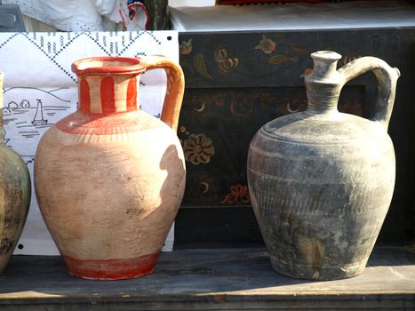 Old jugs for sale at antiques fair       