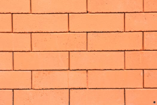 There is the brick wall have colour of orange.