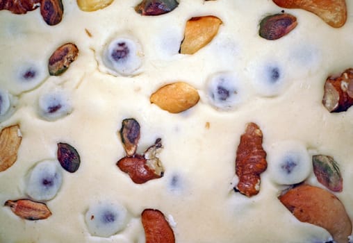 Eastern dessert - milk sherbet with nuts as background