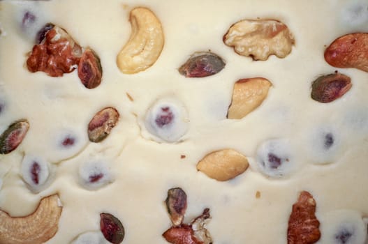 Eastern dessert - milk sherbet with nuts as background