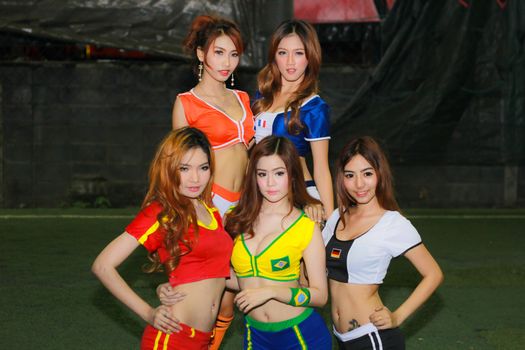 BANGKOK, THAILAND - JUNE 29, 2014: Unidentified model with Football costume pose for promote World Cup 2014 in futsal park on June 29, 2014 in Bangkok, Thailand.