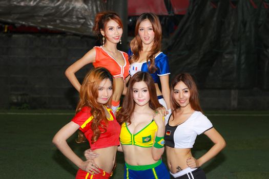 BANGKOK, THAILAND - JUNE 29, 2014: Unidentified model with Football costume pose for promote World Cup 2014 in futsal park on June 29, 2014 in Bangkok, Thailand.