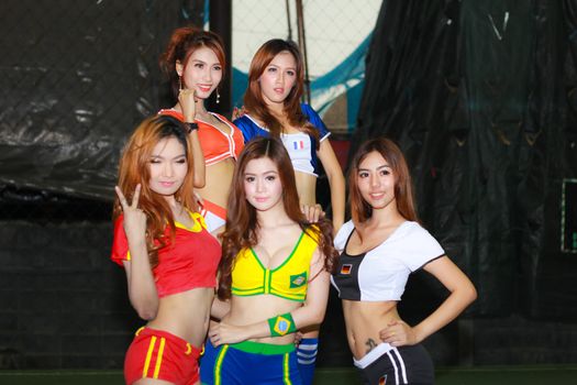 BANGKOK, THAILAND - JUNE 29, 2014: Unidentified model with Football costume pose for promote World Cup 2014 in futsal park on June 29, 2014 in Bangkok, Thailand.