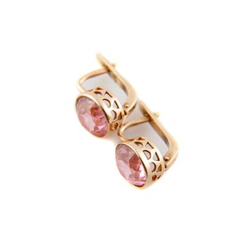 Vintage rose gold earrings with big stone on white background