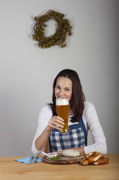 bavarian woman with a sausage
