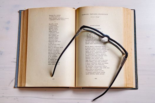 Reading glass on an old book