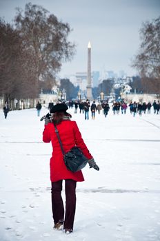 woman in tuileries garden in Paris by winter