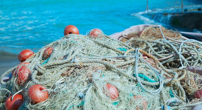 Fishnets massed on the edge of the sea