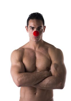Topless Muscled Young Man with Small Red Ball on Nose as Sad Clown Isolated on White Background.