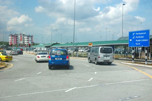 KLCCT, Malaysia - June 7, 2013: Road traffic at Kuala Lumpur Low Cost Carrier Terminal (KLCCT), Malaysia.