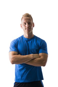 Fit male model posing with a lot of confidence, arms crossed on his chest, isolated on white