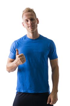Fit young male model posing doing thumb up gesture, isolated on white