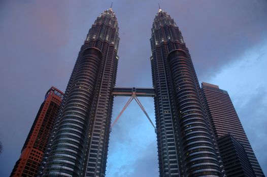 Kuala Lumpur, Malaysia - June 8, 2013: The Petronas Towers, also known as the Petronas Twin Towers are twin skyscrapers in Kuala Lumpur, Malaysia.