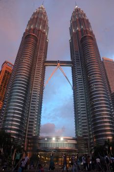 Kuala Lumpur, Malaysia - June 8, 2013: The Petronas Towers, also known as the Petronas Twin Towers are twin skyscrapers in Kuala Lumpur, Malaysia.