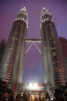 Kuala Lumpur, Malaysia - June 8, 2013: The Petronas Towers, also known as the Petronas Twin Towers are twin skyscrapers in Kuala Lumpur, Malaysia.