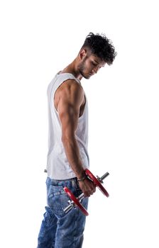 Handsome muscular young man exercises with dumbbells, poses isolated on white
