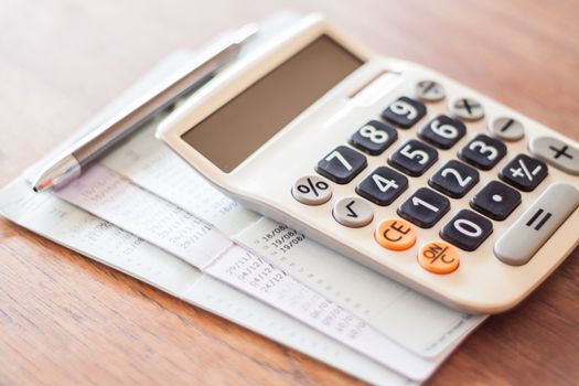 Calculator and pen with bank account passbook, stock photo