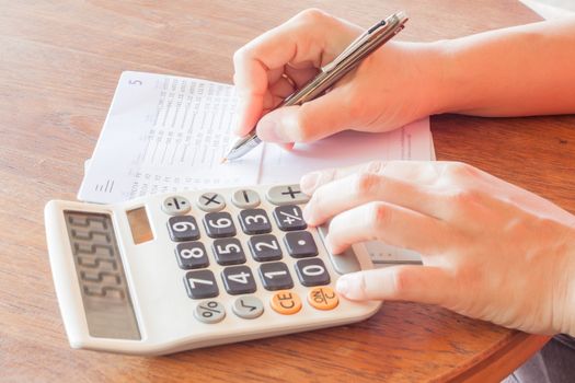 Businesswoman check bank account passbook, stock photo