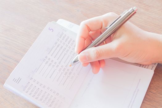 Businesswoman working on finance, stock photo