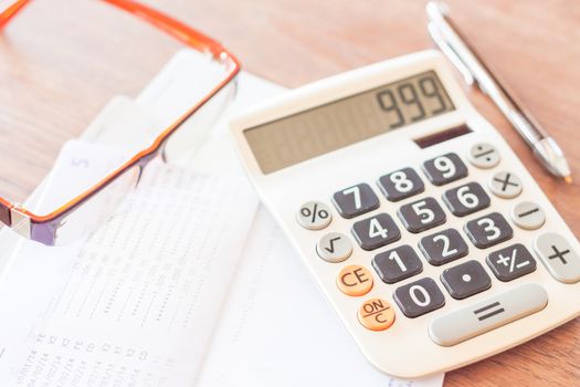 Bank account passbook with pen, calculator and eyeglasses, stock photo