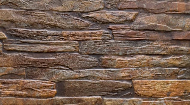 pattern brown color of modern style design decorative uneven cracked real stone wall surface with cement