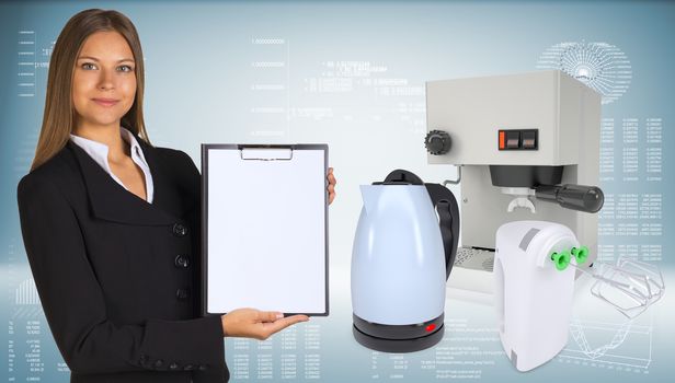 Businesswoman hold paper holder. Coffee machine, kettle and blender