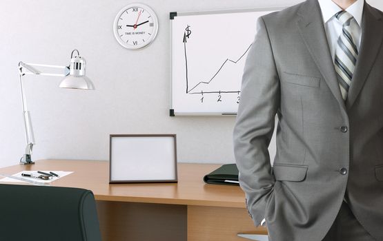 Businessman in suit. Office working place in the background