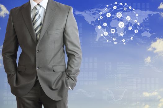 World map with app icons. Standing businessman in a suit