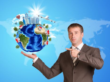 Businessman in a suit hold Earth with buildings. Elements of this image are furnished by NASA