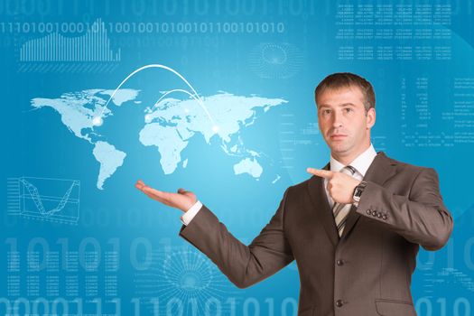 Businessman in a suit hold world map on blue background 