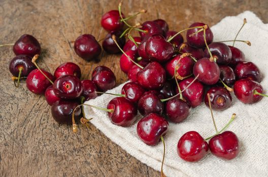 fresh organic cherries on wooden table  background