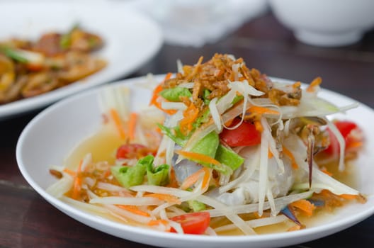 spicy papaya salad with crab on dish , asian spicy food