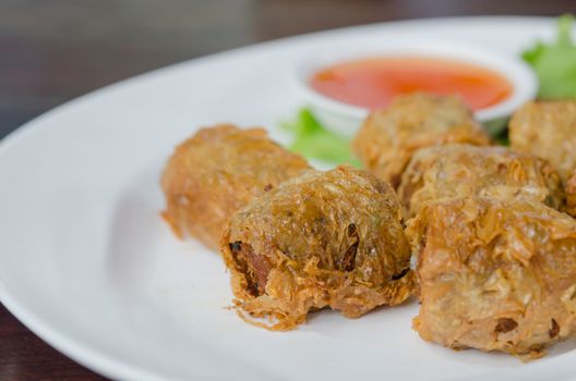 deep fried crab meat roll cake on white dish , chinese food