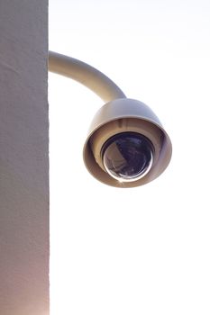 Hi-tech dome type camera on a wall