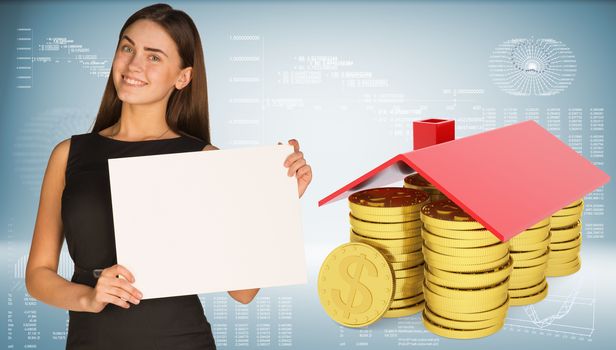 Businesswoman hold paper sheet. Conceptual house made from coins. Graphs and texts as backdrop