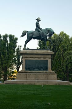 Photo shows details of city statue in the park.