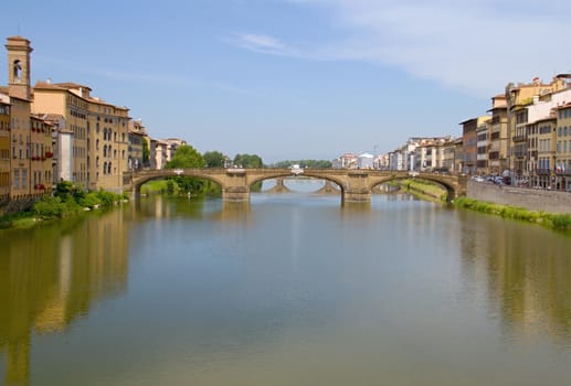 Photo shows a general view onto the city river bank with its houses.