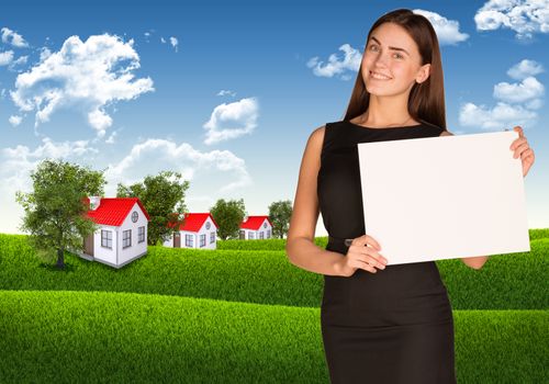 Businesswoman hold white paper. Blue sky, green grass and houses as backdrop