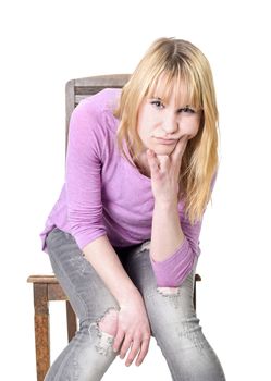 unhappy young woman sitting on chair