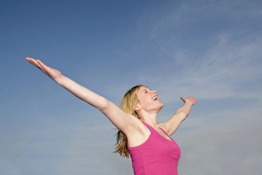 woman feeling free with arms wide open