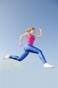 happy young blond woman jogging