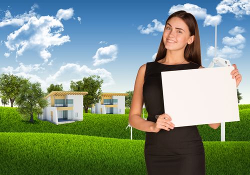 Businesswoman hold white paper. Blue sky, green grass and houses as backdrop