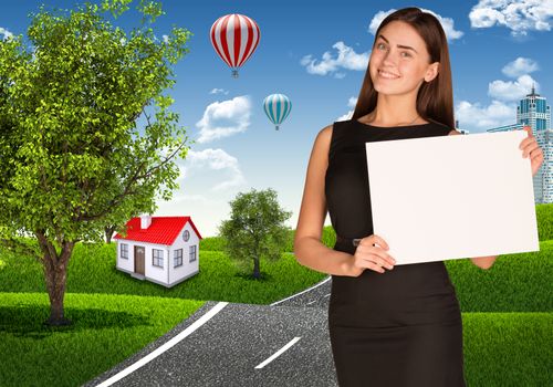 Businesswoman holding paper sheet. Road near the small house as backdrop