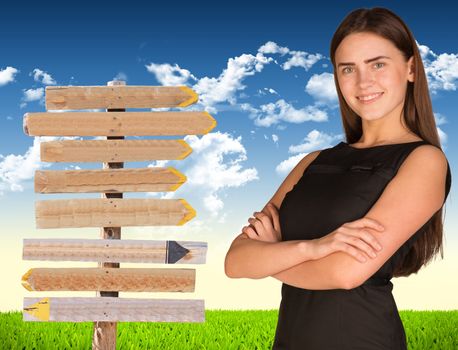 Businesswoman stand crossed his arms. Road sign in green grass field as backdrop