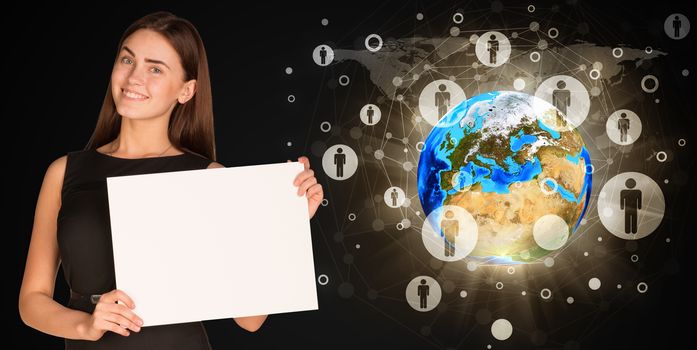 Businesswoman holding paper sheet. Earth and contacts as backdrop. Elements of this image are furnished by NASA
