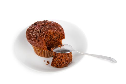 Chocolate muffin on a white plate isolated on white background