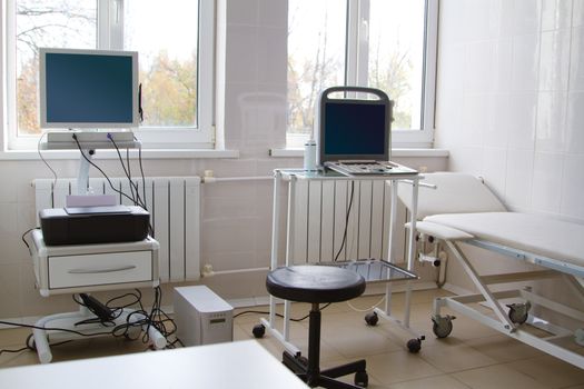 Hospital ward with bed and medical equipment