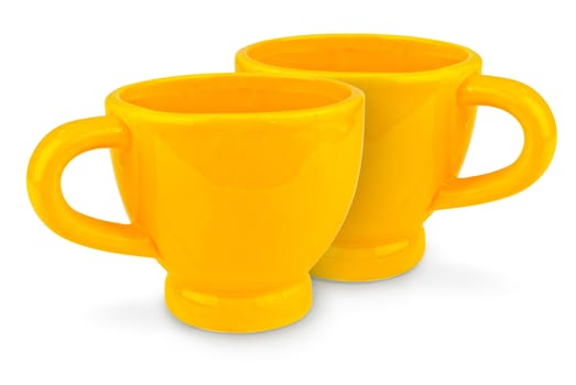 Two yellow ceramic cup isolated on white background