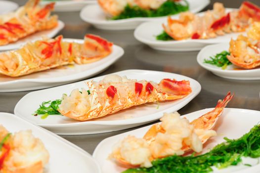 Prepared lobster and sea weed on plates